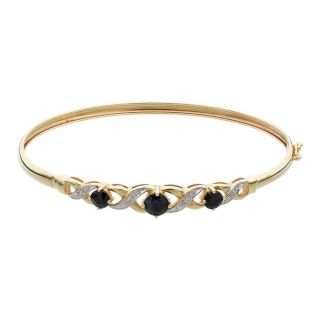 Vòng tay mềm dẻo bằng vàng đính đá sapphire và kim cương.