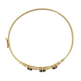 Vòng tay mềm dẻo bằng vàng đính đá sapphire và kim cương.